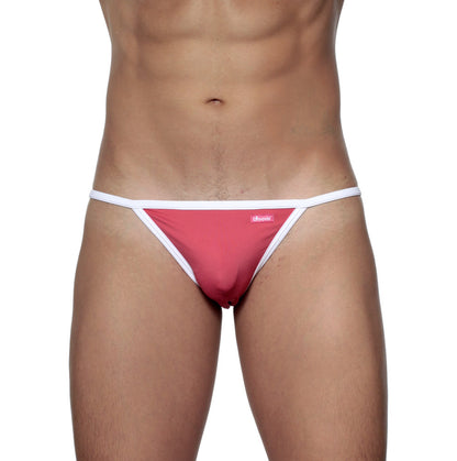 A vibrant pink groovin accent string bikini with white trim and a small brand tag in rouge red color