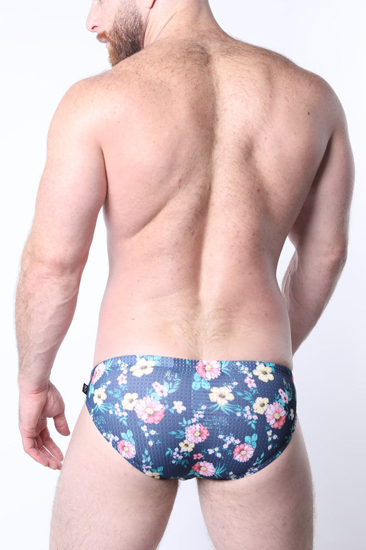 Balboa low rise swim brief in dark blue with pink yellow and white floral pattern for men