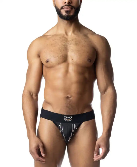 Black athletic barbed wire jockstrap with white lightning bolt design and logo on waistband front view