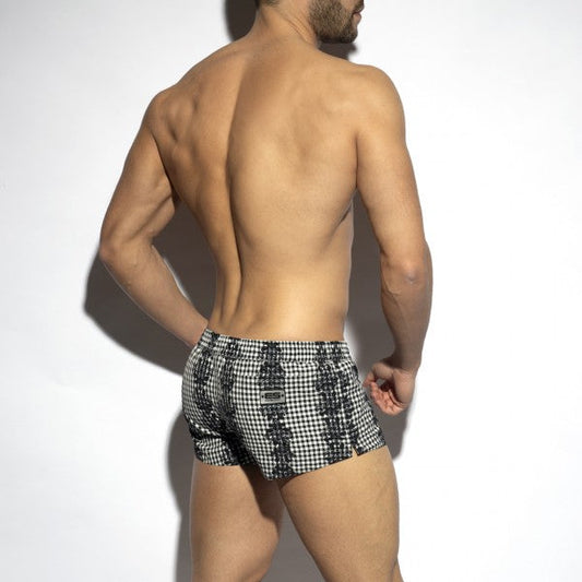 Black and white checkered swim trunks with a bold geometric pattern from Baroque Squared swim shorts collection