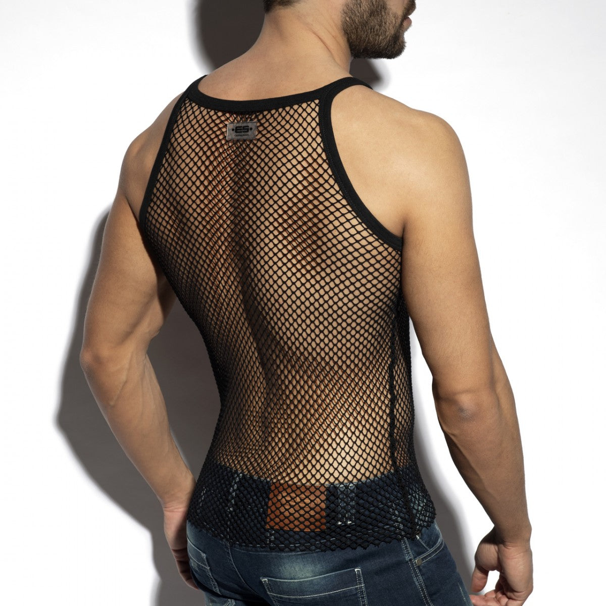 Black mesh beachy net strap tank top with reinforced black trim and small metallic brand tag at the neckline