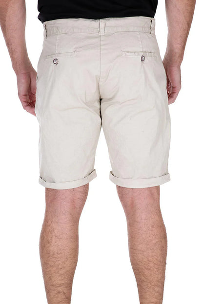 Rear view of beige cotton shorts with cuffed hems and buttoned back pockets.