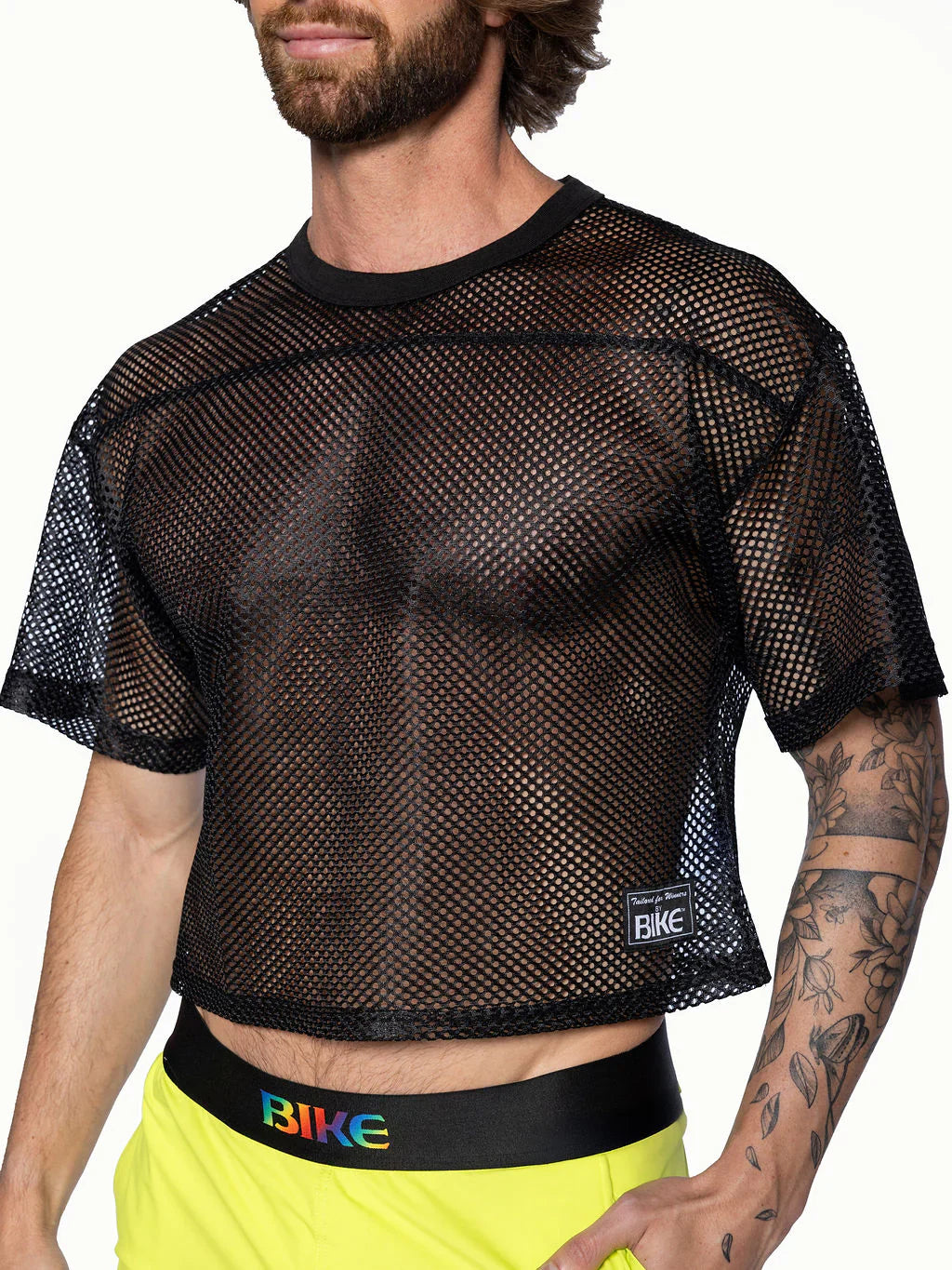 Black mesh crop top with subtle herringbone pattern and bike brand label on lower left side from BIKE® Practice Jersey