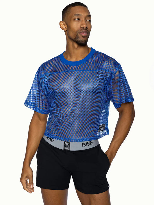 Blue mesh crop top bike practice jersey with solid blue ribbed neckline and sleeve edges for active wear