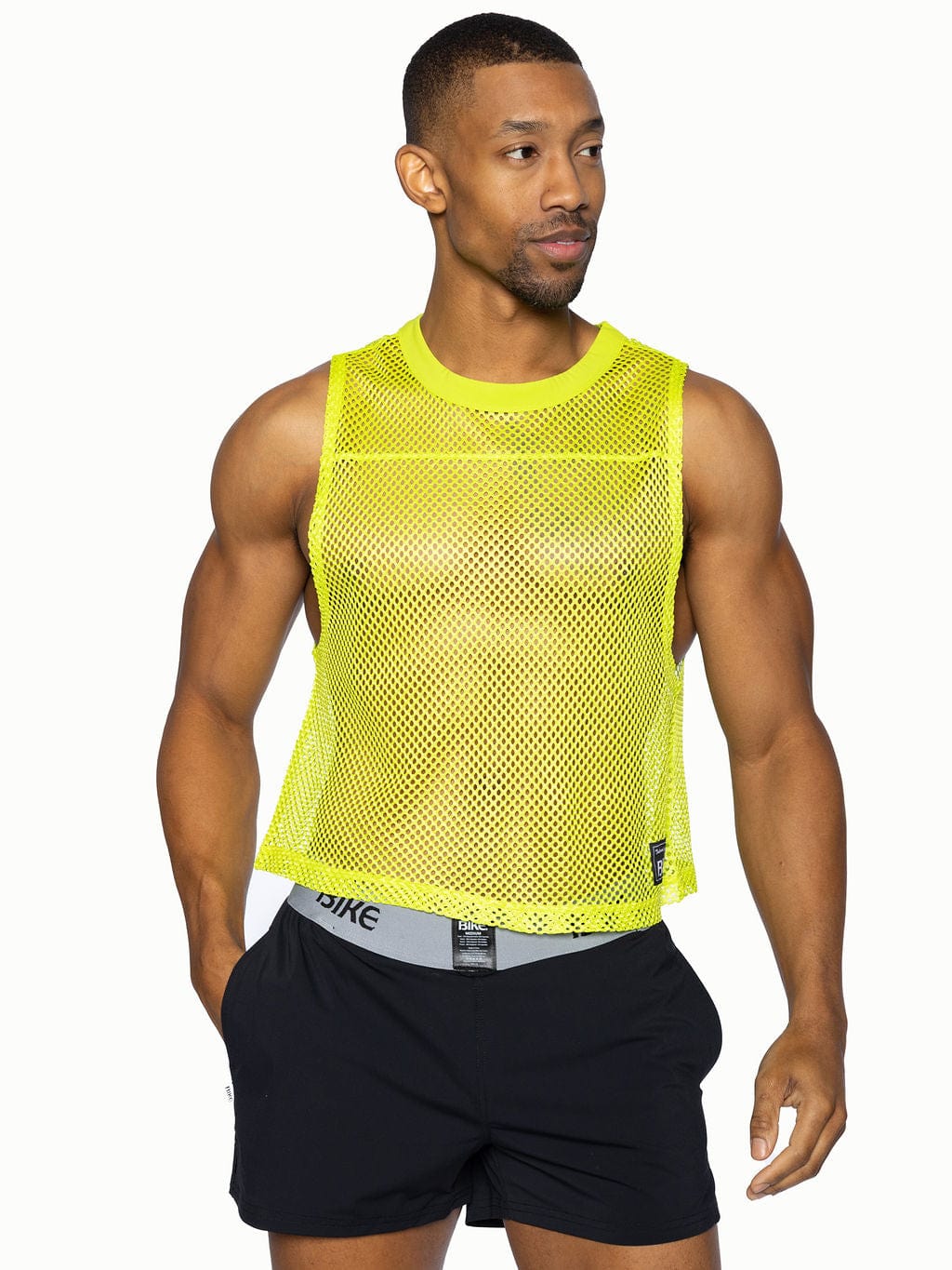 Bright neon yellow bike sleeveless practice jersey mesh tank top with round neckline and subtle perforations