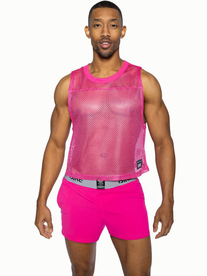 Bright pink mesh sleeveless practice jersey with rounded neckline and small black bike brand tag on lower right side