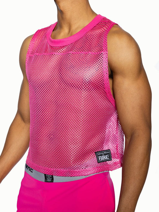 Bright pink bike sleeveless practice jersey with mesh fabric and solid ribbed neckline and hem