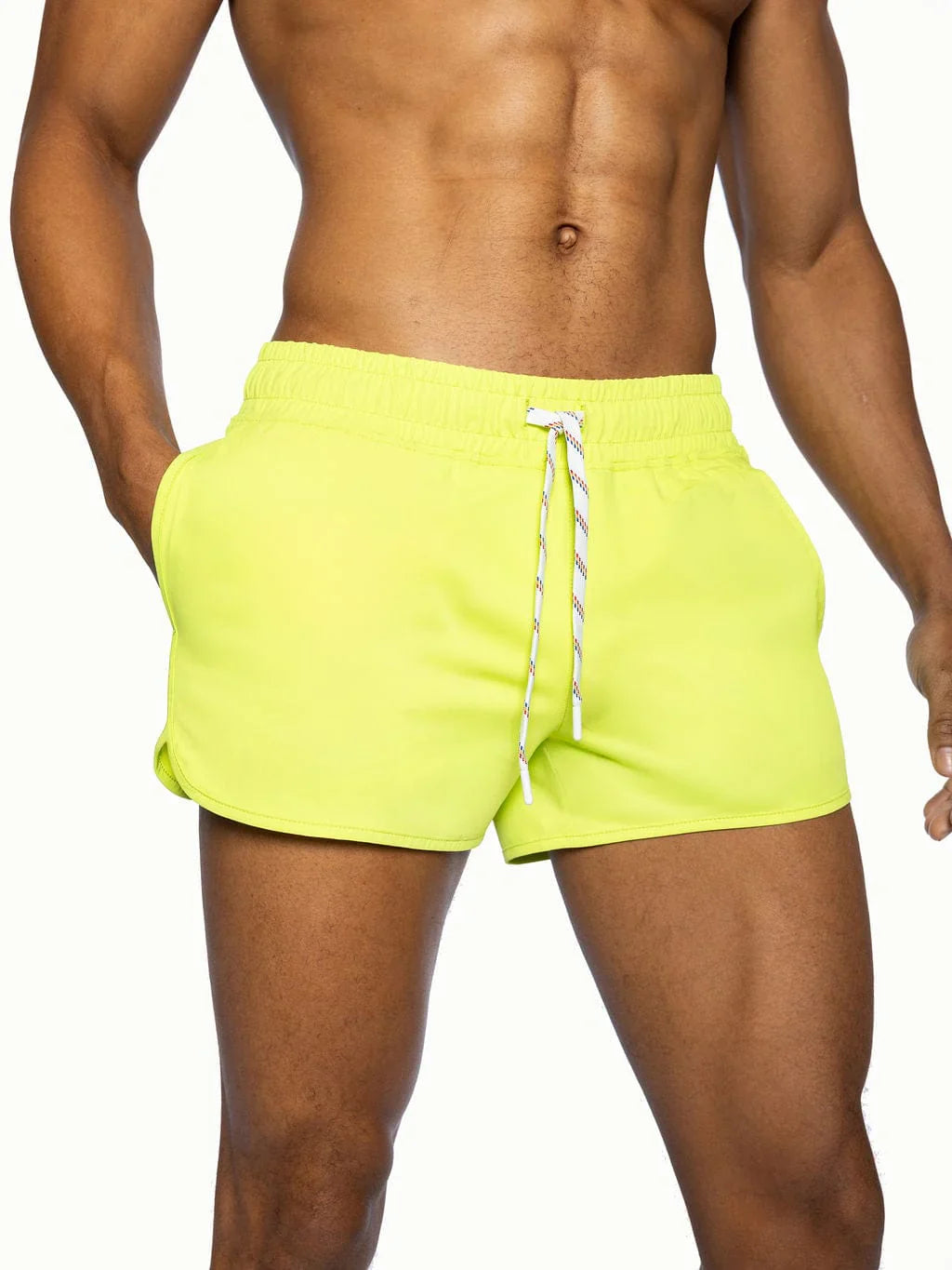 Bright neon yellow BIKE track shorts with white drawstring designed for athletic performance and comfort
