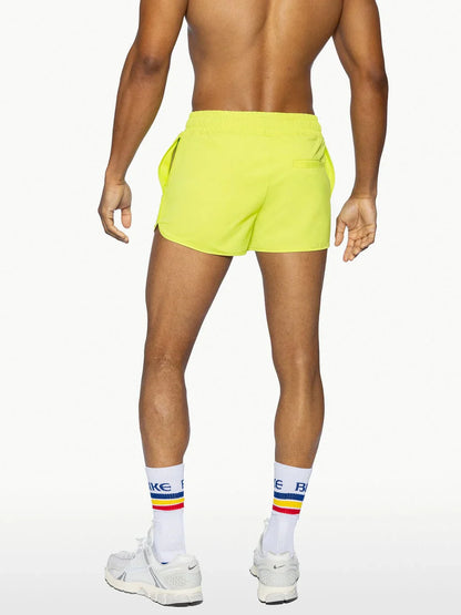 Bike® track short bright neon yellow athletic shorts with sleek modern design and side pockets for active use