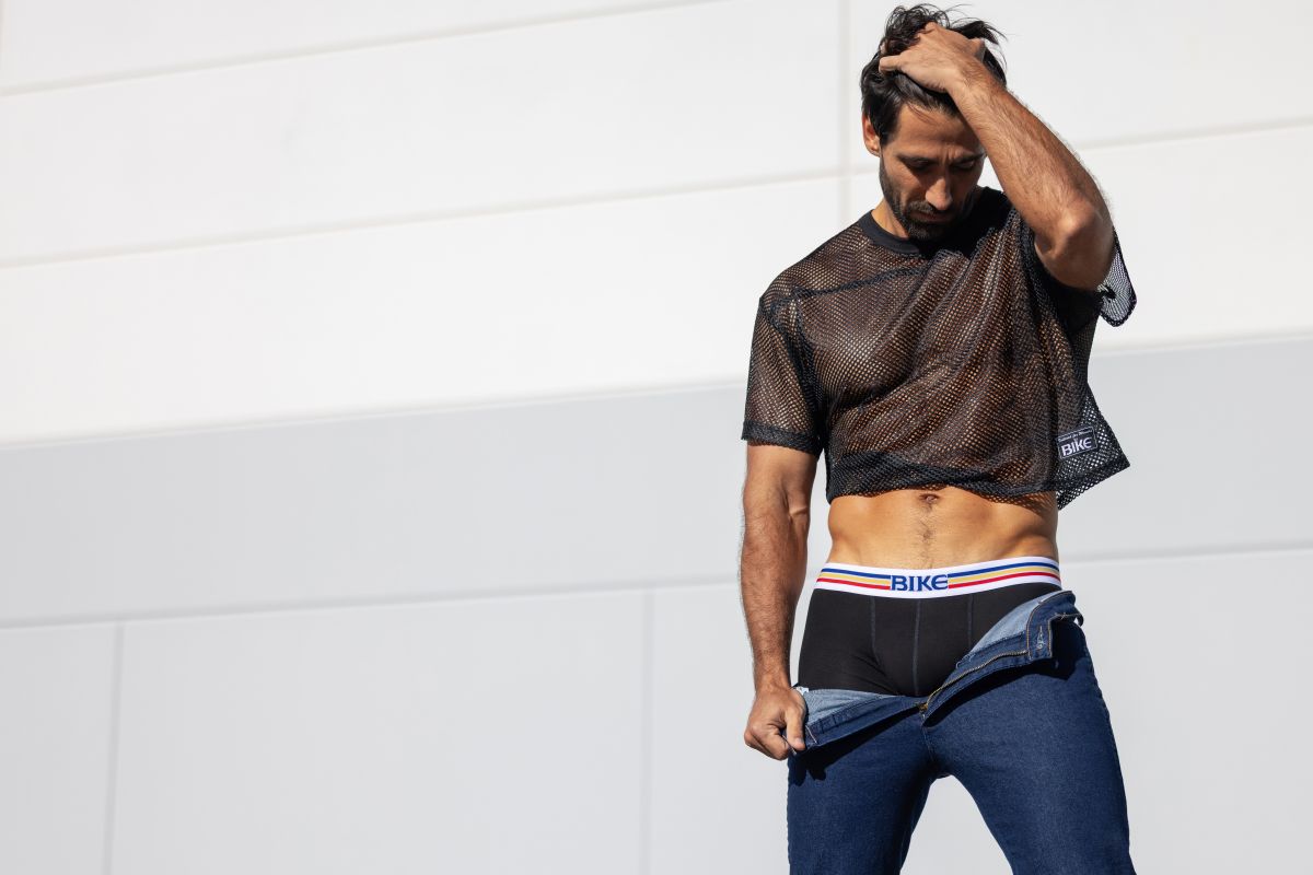 Black mesh crop top with short sleeves and cropped hemline from BIKE athletic BAM134 practice jersey in bold color black
