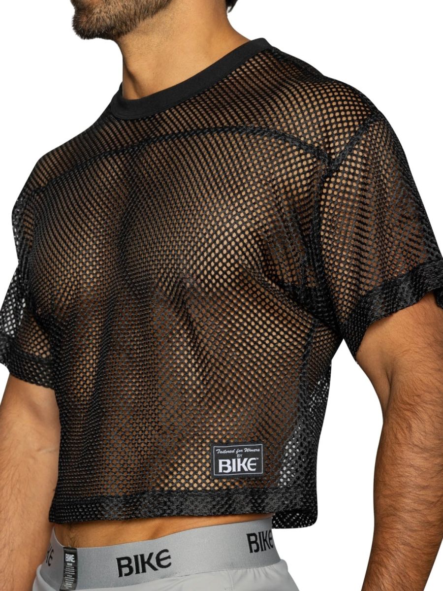 Black mesh crop top with solid black ribbed neckline and cuffs featuring bike label in bold color black