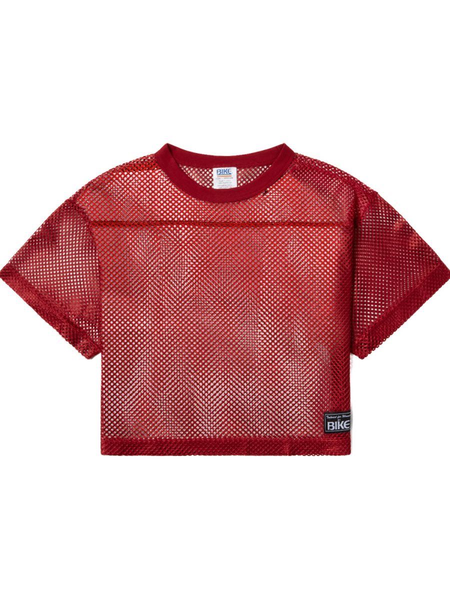 Red mesh crop top with ribbed crew neckline short sleeves and black bike patch in bright red for athletic practice