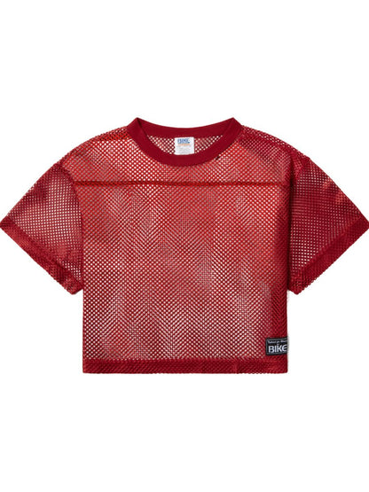 Red mesh crop top with ribbed crew neckline short sleeves and black bike patch in bright red for athletic practice