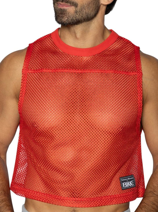 Red mesh crop top with solid red ribbed neckline and hem featuring black bike brand patch on lower right side