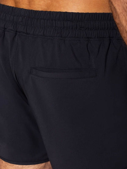 Black bike athletic bam200 track shorts with elastic waistband and single back pocket shown from the back side