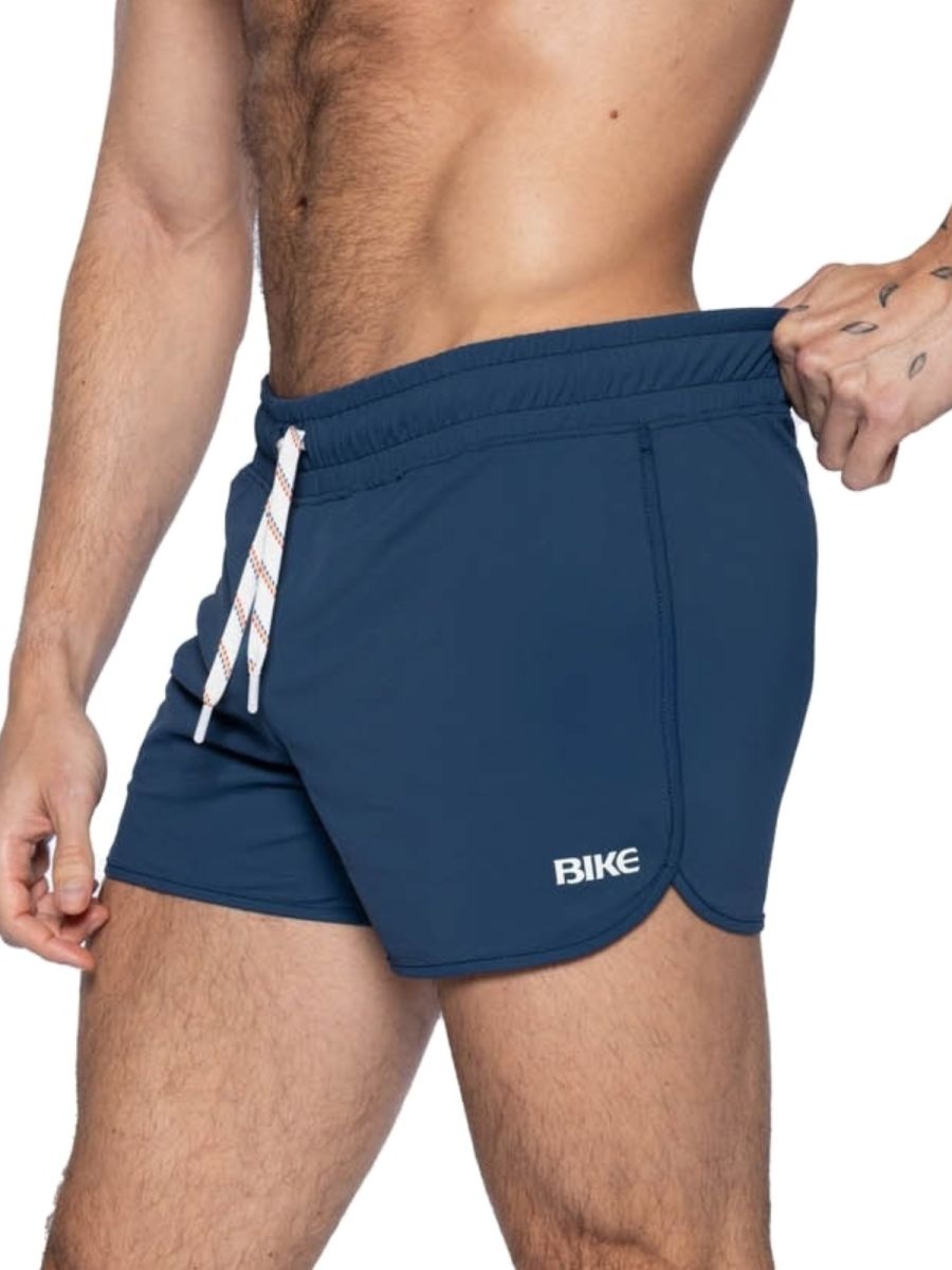Navy blue bike athletic bam200 track shorts with white drawstring and bike logo on the side for active wear