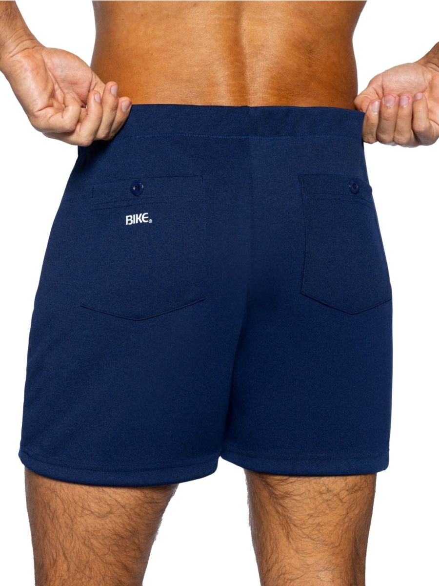 Back view of navy bike athletic bam207 coaches shorts with two pockets and white bike logo on left pocket