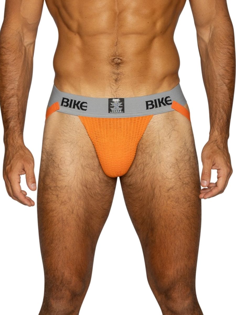 BIKE Men's orange jockstrap with grey waistband and orange accents.