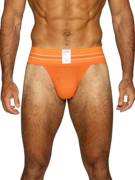Orange BIKE athletic jockstrap with a white label and horizontal stripe waistband.