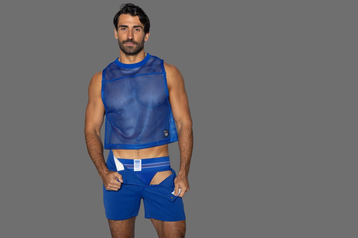 Blue mesh sleeveless crop top with subtle branding on lower left side from BIKE Athletic in royal color