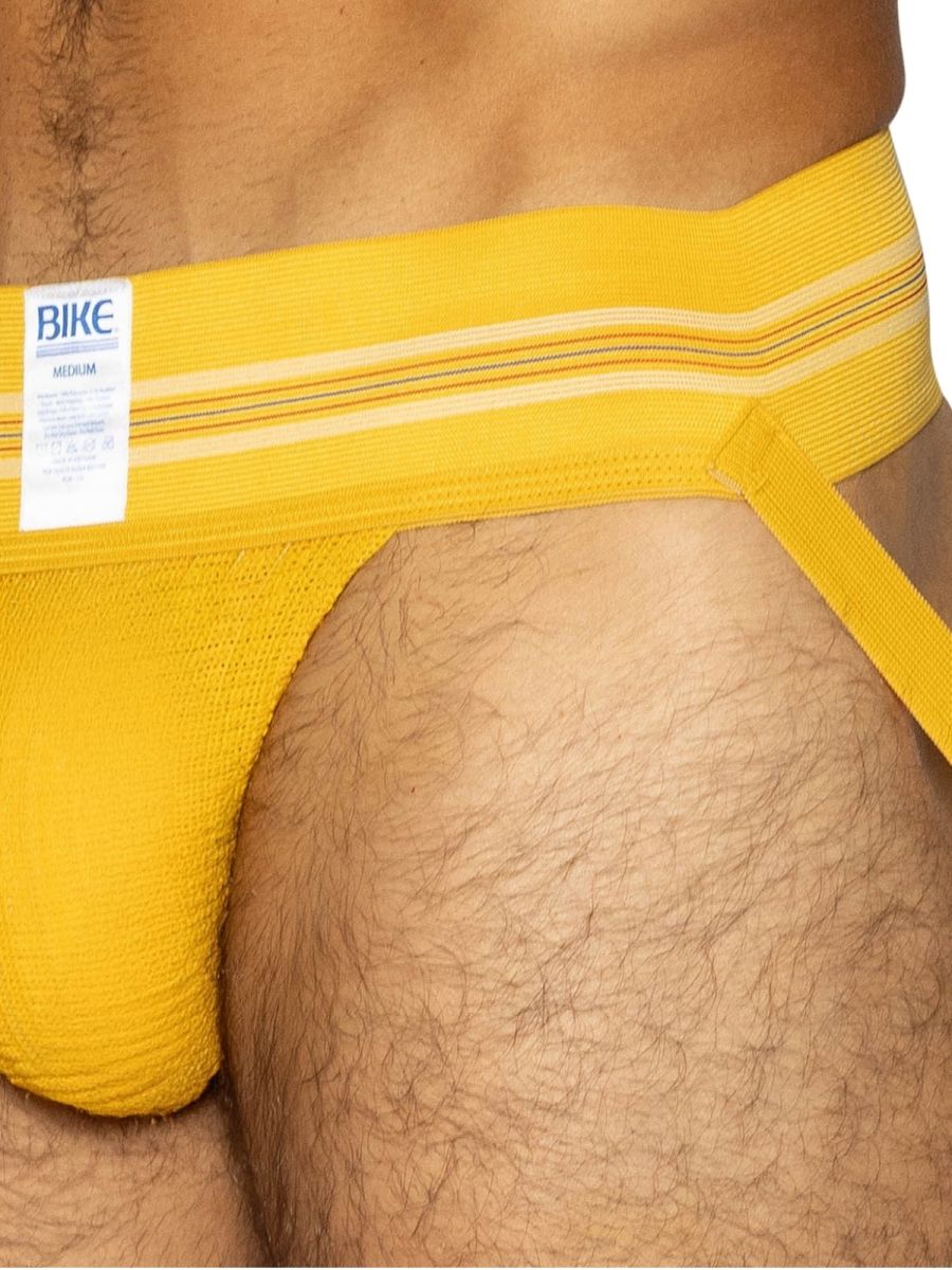 Bright yellow BIKE athletic briefs with textured fabric and white striped waistband designed for active use