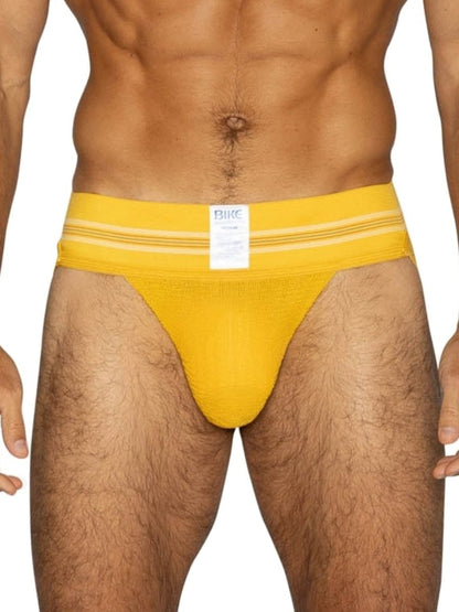 Bright yellow bike athletic briefs with white stripes and brand label designed for sports and active use