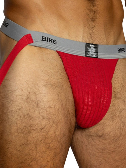 Red BIKE athletic jockstrap with a grey waistband and red fabric pouch.