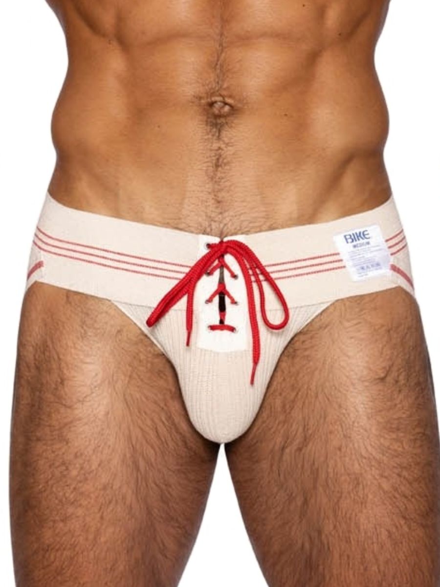 Cream-colored ribbed mens briefs with red lace-up detail and matching waistband stripes from bike athletic vintage line