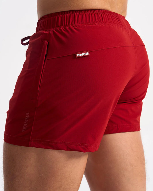 Red teammb bolt 3 inch athletic shorts with elastic waistband and side pocket for active use