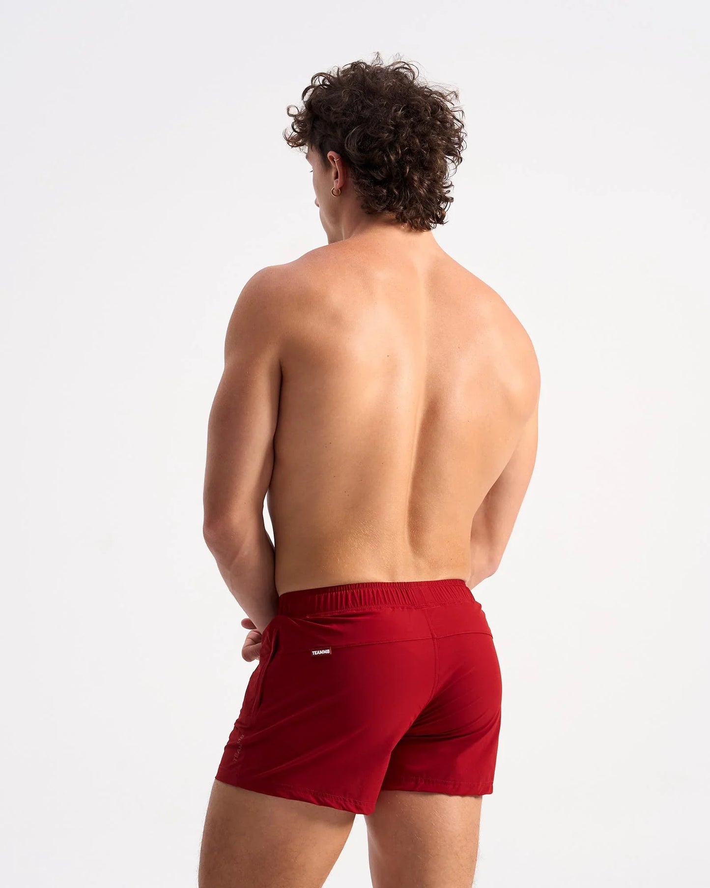 Red bolt 3 inch athletic shorts with snug elastic waistband and small brand logo on side seam