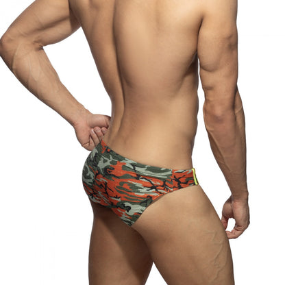 Bright camo swim brief with orange and green camouflage pattern and yellow trim designed for swimming use