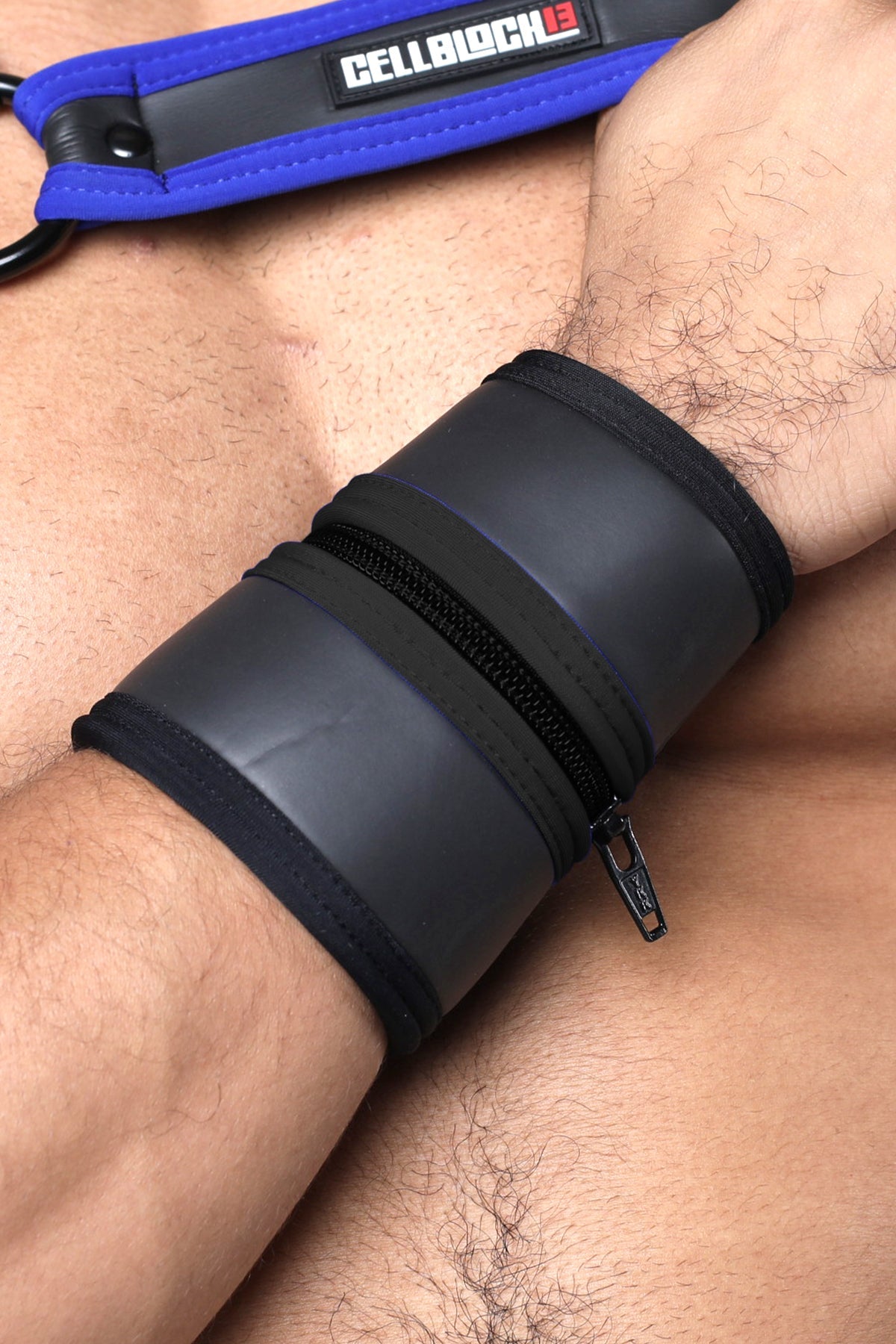 Black leather buckle up cuff with zipper closure and blue branded strap available in five colors