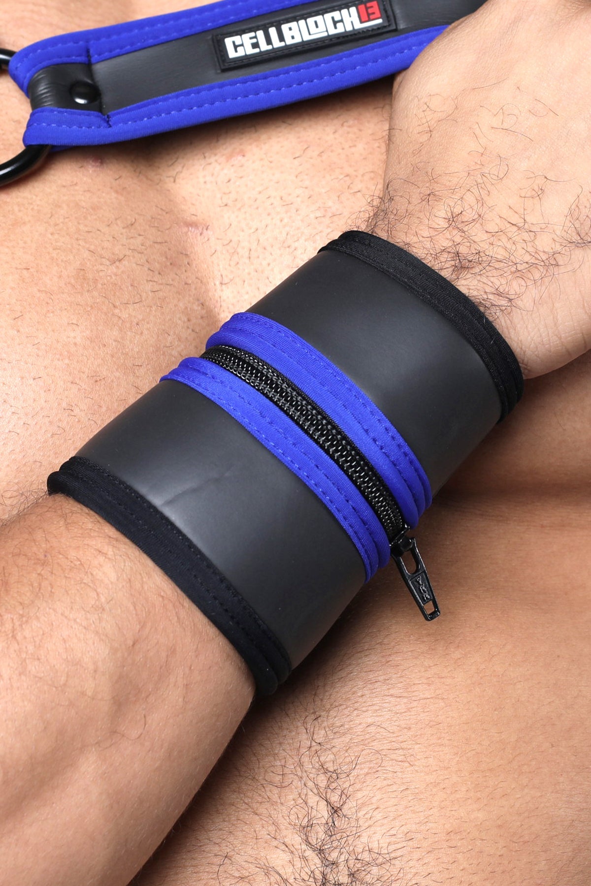 Blue and black leather buckle up cuff with zipper detail available in five colors for stylish wristwear