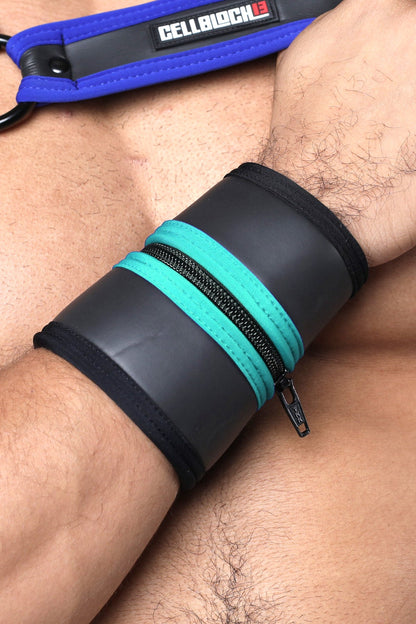 Black and teal zippered wrist cuff with blue strap and cellblock logo buckle up cuff available in five colors