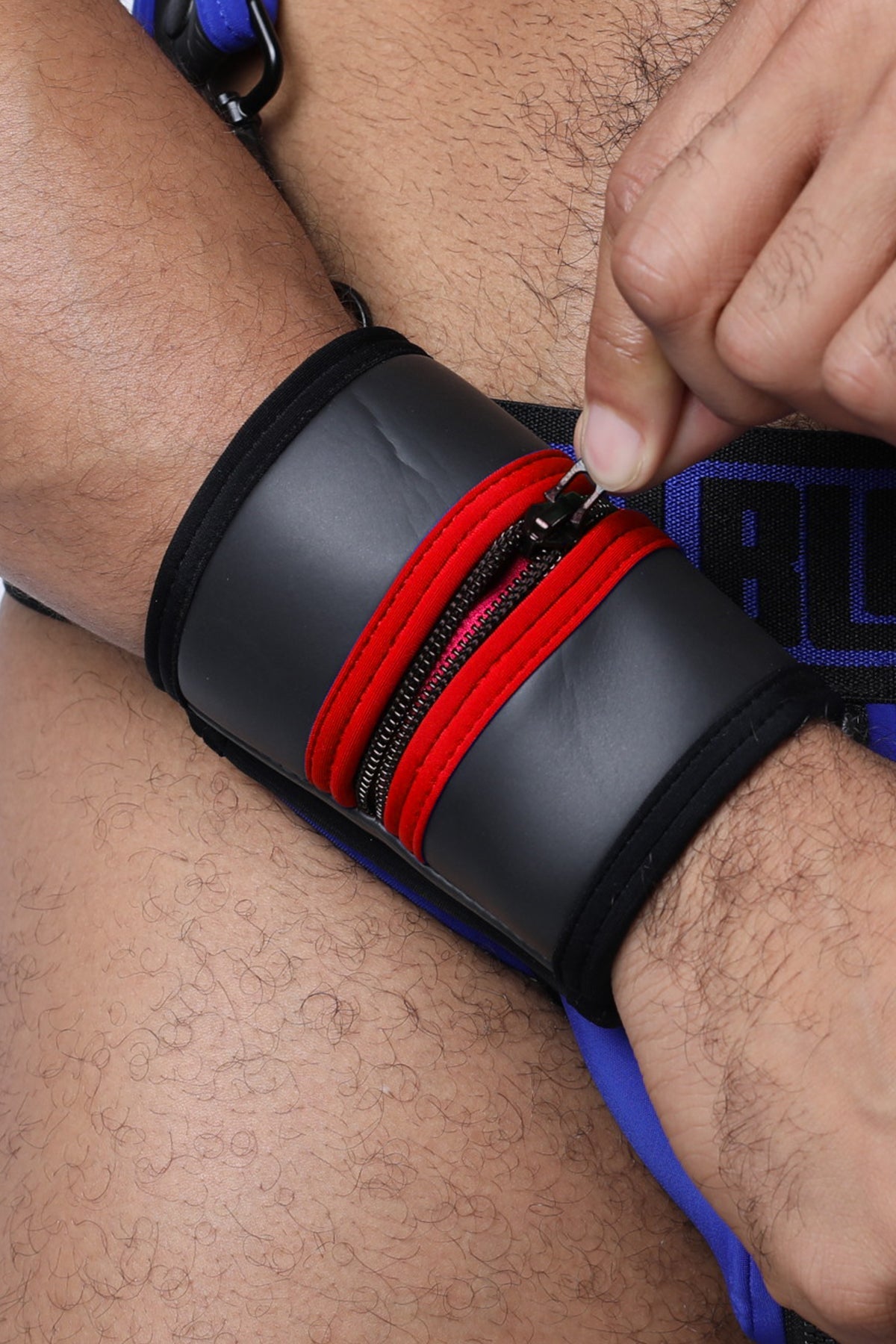 Black buckle up cuff wristband featuring red zipper accents available in 5 colors for stylish wear