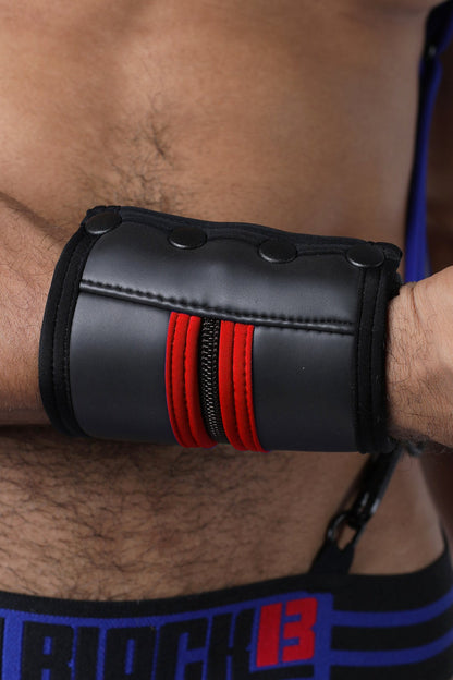 Black leather buckle up cuff wristband with red zipper accents and three black snap buttons available in 5 colors