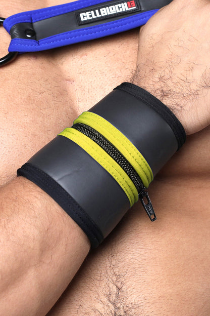 Buckle Up cuff wrist cuff with black and neon yellow zipper and blue cellblock branded strap available in 5 colors