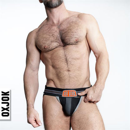 Black and gray bulger jockstrap briefs with bold orange big dick logo on waistband, featuring oxjok design