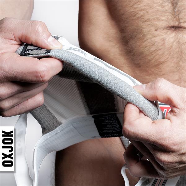 Gray and white bulger jockstrap athletic briefs with textured fabric waistband for comfortable support