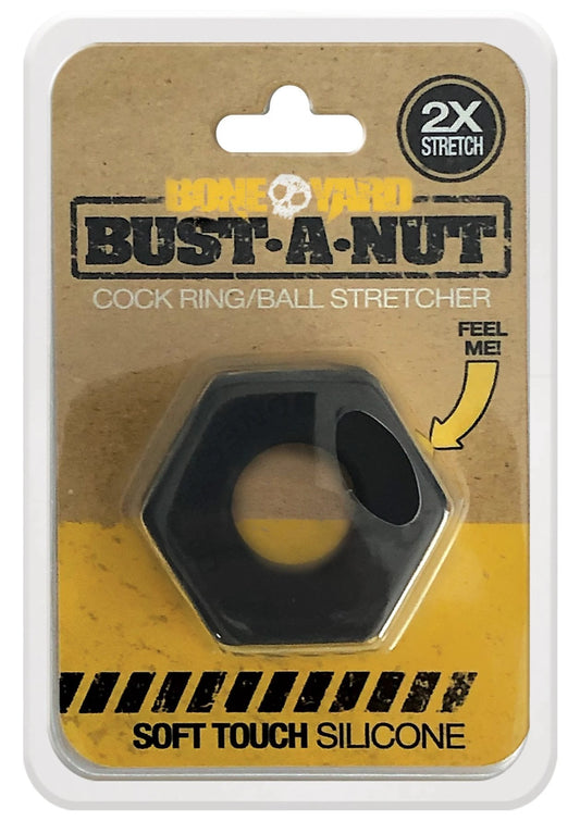 Black hexagonal silicone cock ring with central hole and side cutouts in bust a nut cardboard blister pack by bone yard