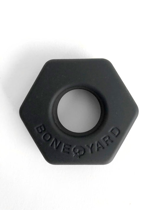 Black hexagonal silicone ring bust a nut with bone yard embossed around the center for comfortable everyday wear