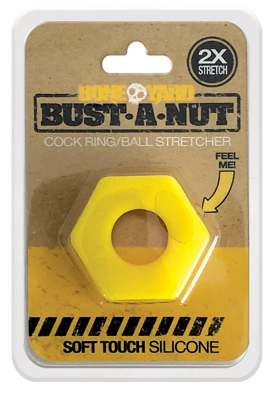 Bright yellow hexagonal silicone ring with central hole packaged in cardboard and plastic for bust a nut product