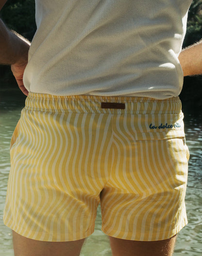 Byron swim short in yellow and white wavy stripes with a brown leather la dolce vita brand tag