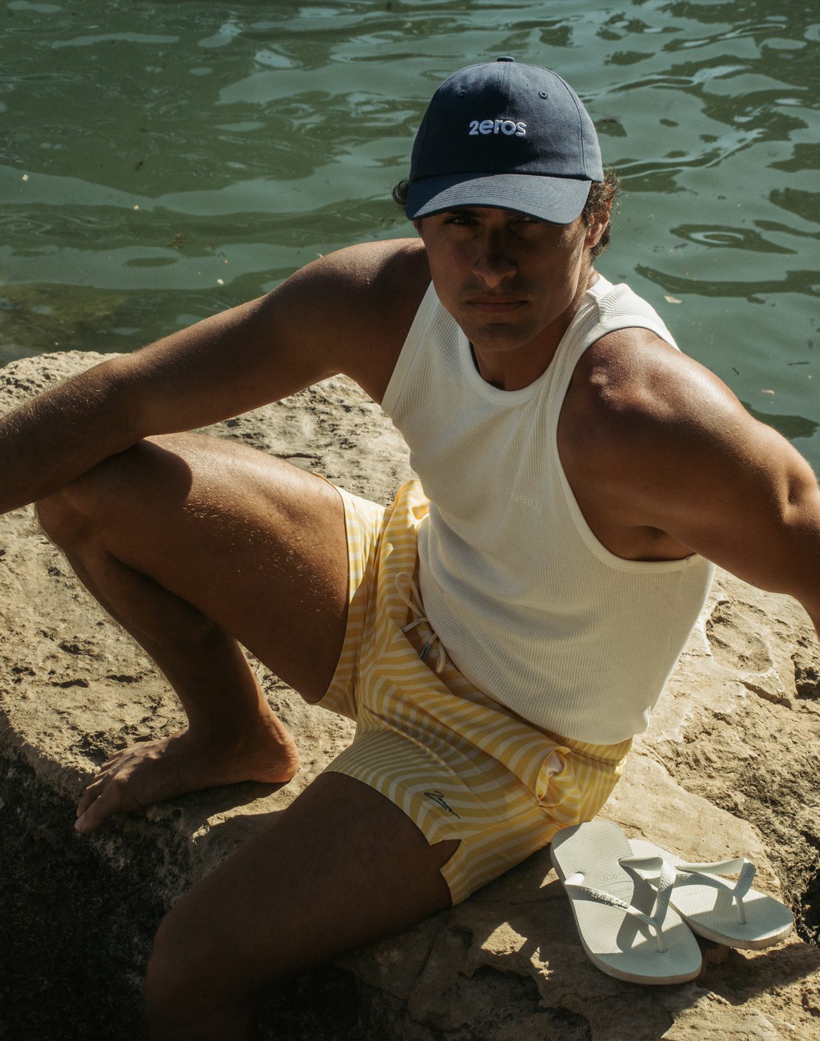 Navy blue baseball cap with white embroidered 2eros logo paired with byron swim short in dolce yellow color