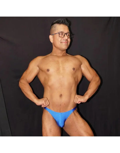 Blue bikini jockstrap underwear made of soft material showcased by a model with a muscular build by Arroyman.