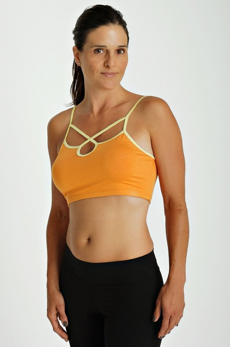 Orange bra top tangerine with cream crisscross straps and racerback design for activewear and fitness use