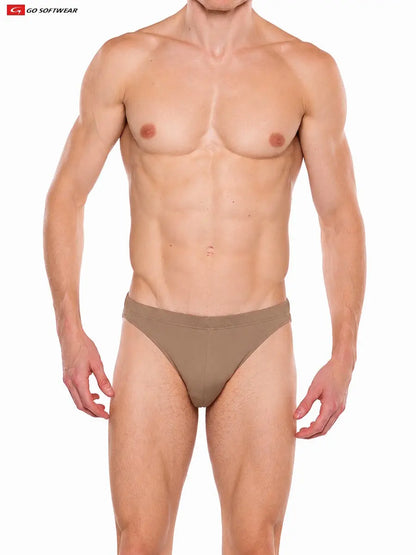 Model wearing brown suede men's contour brief by Go Softwear featuring a snug fit and minimal coverage