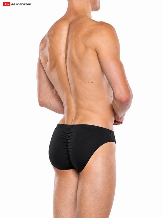 Model wearing Go Softwear black contour brief showcasing a fitted design and gathered back detail viewed from the side