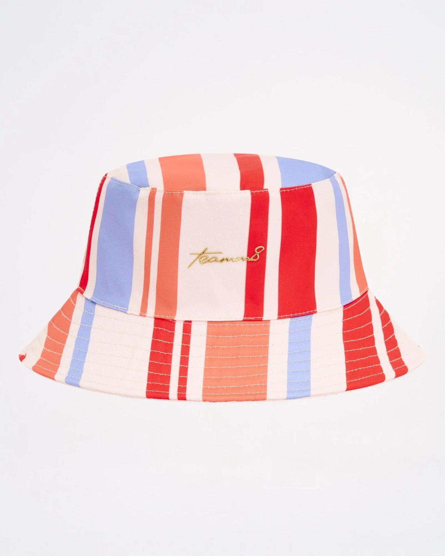 Cabana bucket hat with vibrant red blue and cream vertical stripes and subtle gold embroidered logo on front