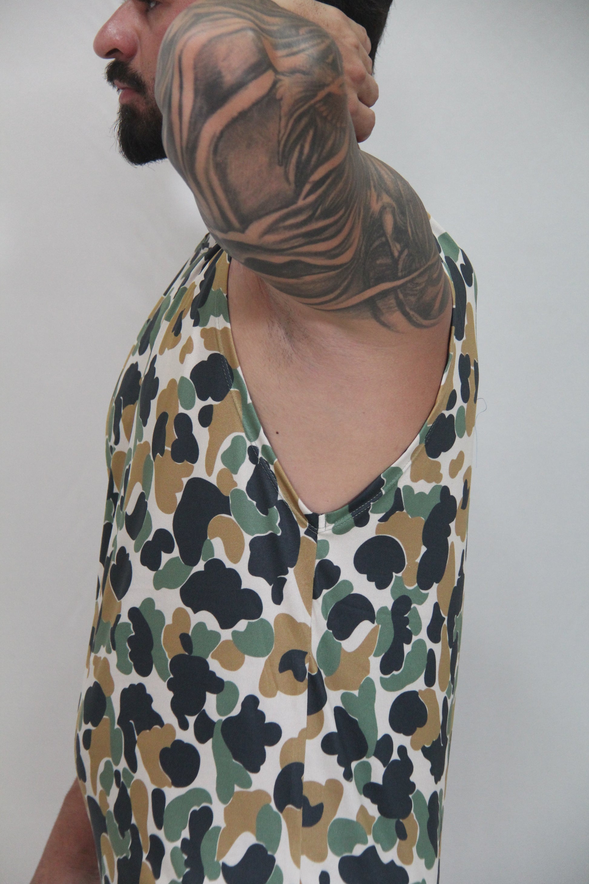 Camouflage open arm tank sleeveless top with white base and black olive green splotches in cotton fabric